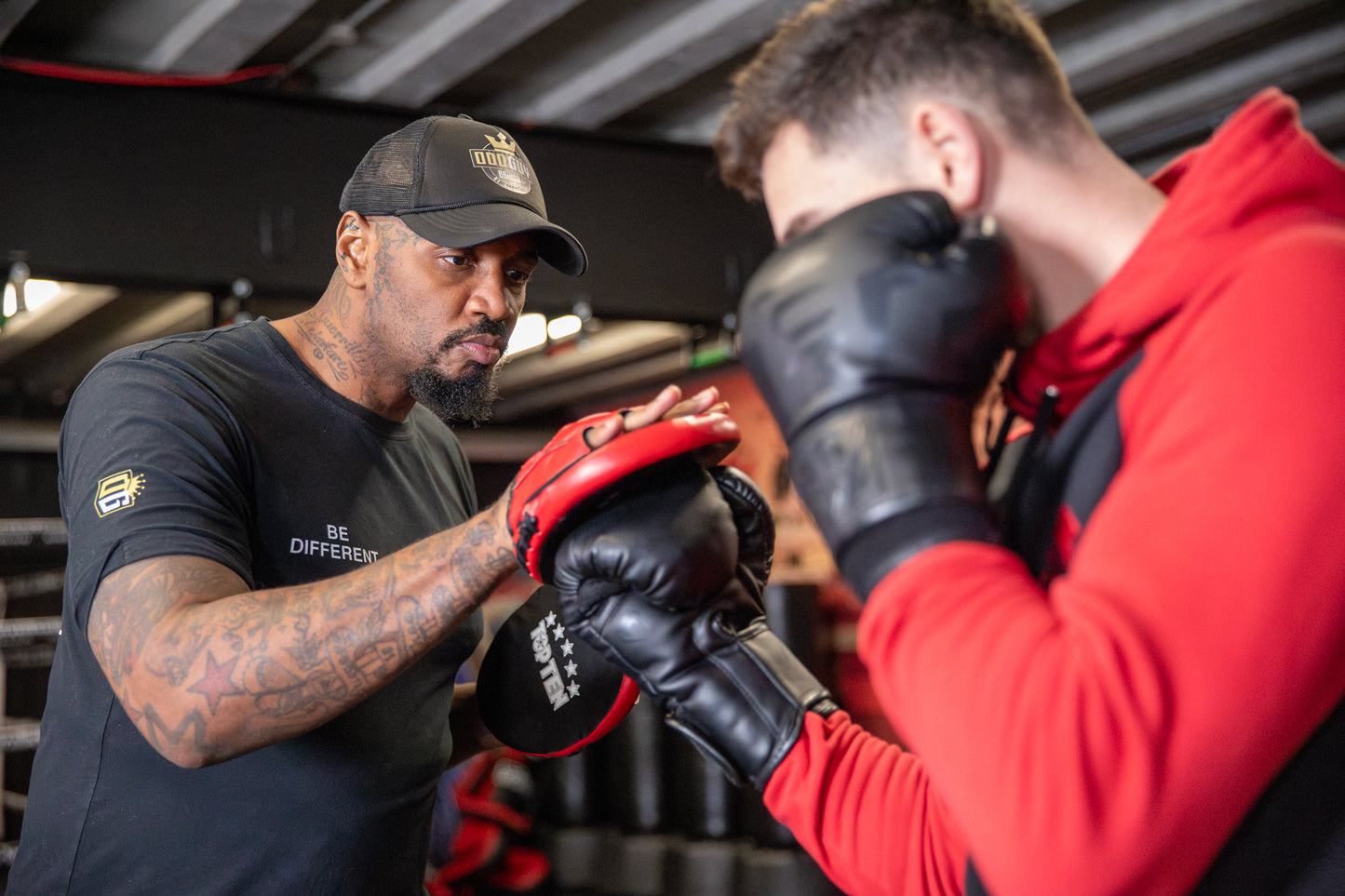 A photo of a Boxer demonstrating a rear uppercut whilst training