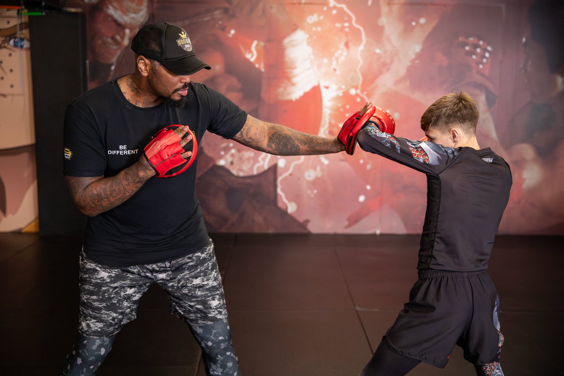 A photo of a Boxer demonstrating a forearm defence whilst training