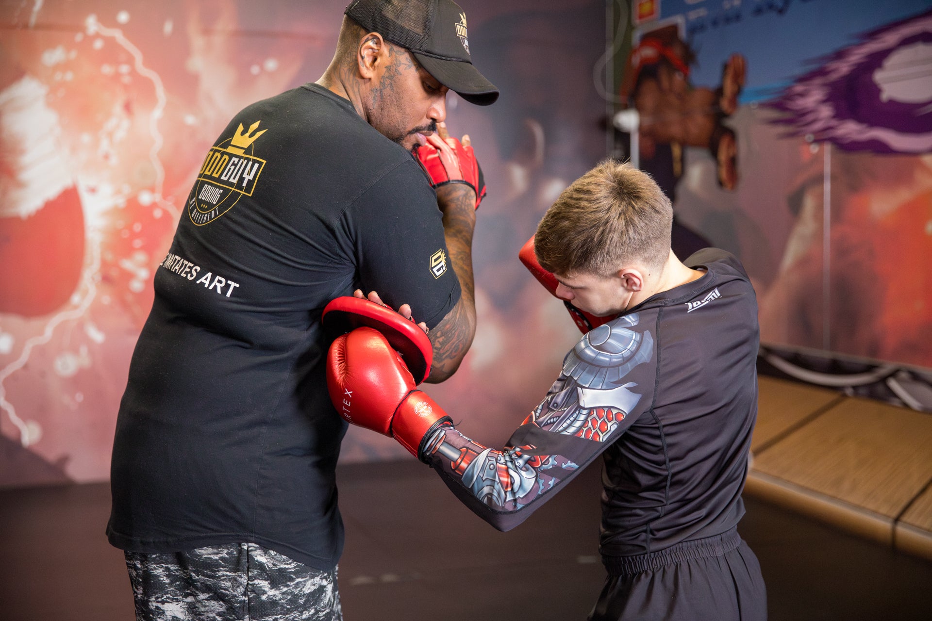 A photo of a Boxer demonstrating a body shot whilst training