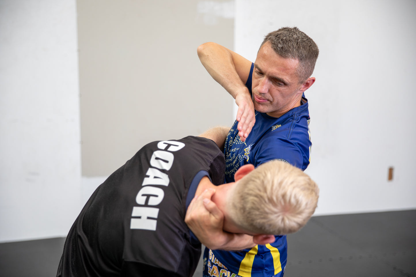 A photo of two Muay Thai fighters demonstrating techniques.