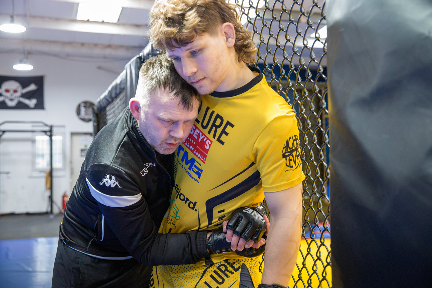 A photo of two MMA fighters training