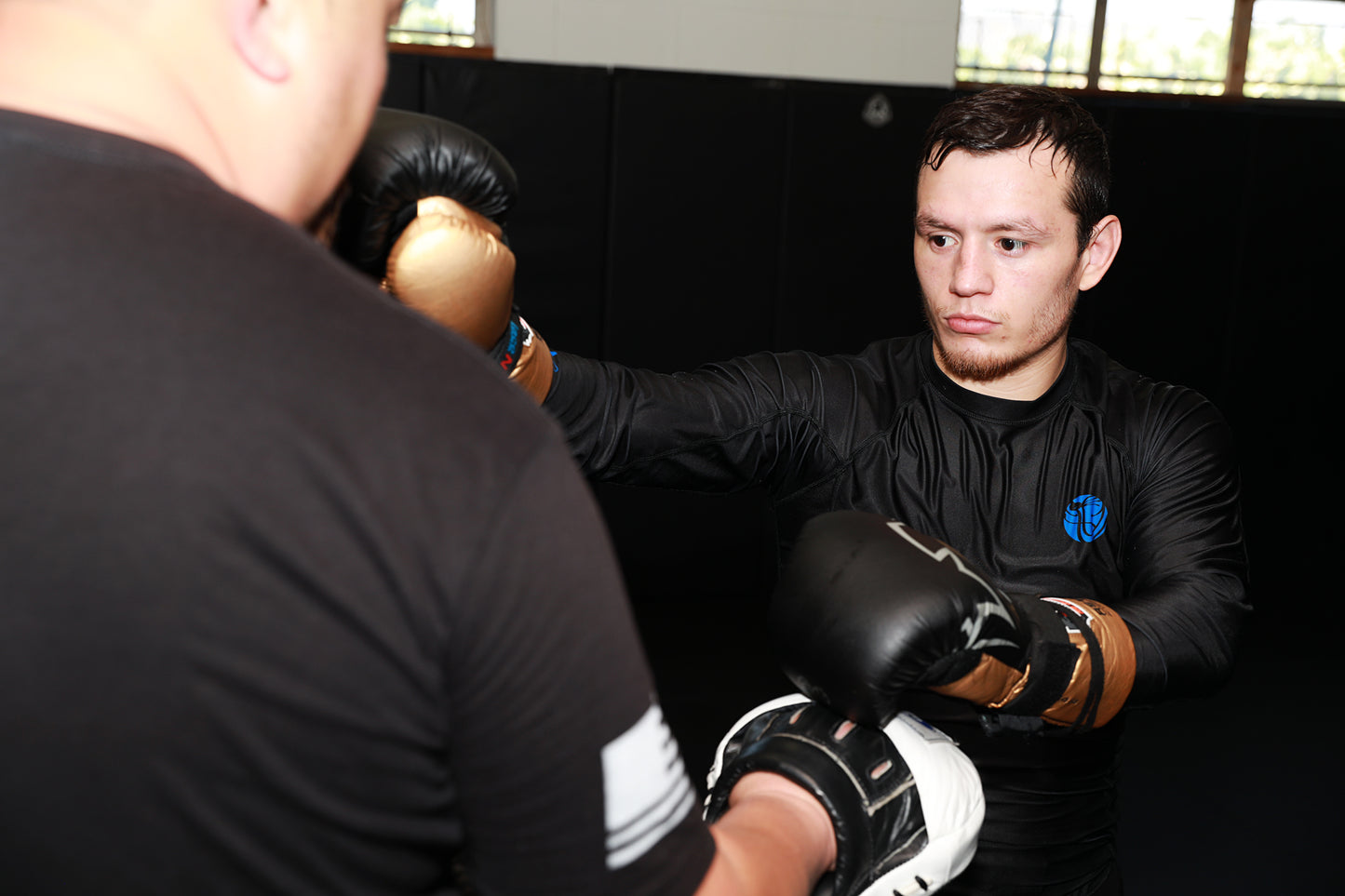 A photo of Dr Jason Park and his pro fighter from The Foundation of Muay Thai - Building Elite Fighters volume on the Warrior Marketplace