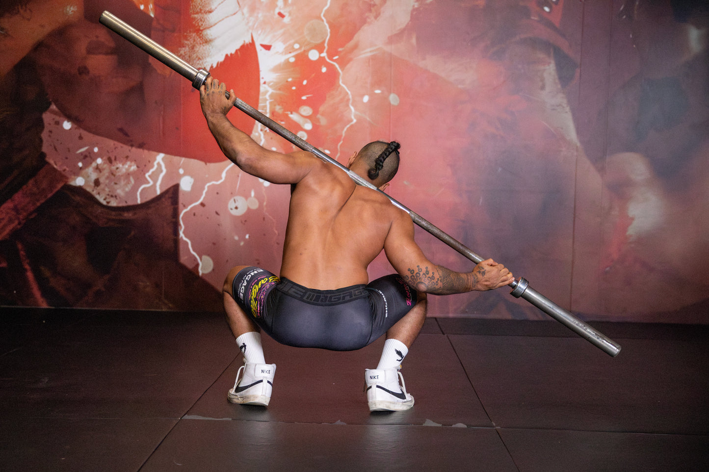 A photo displaying a barbell exercise