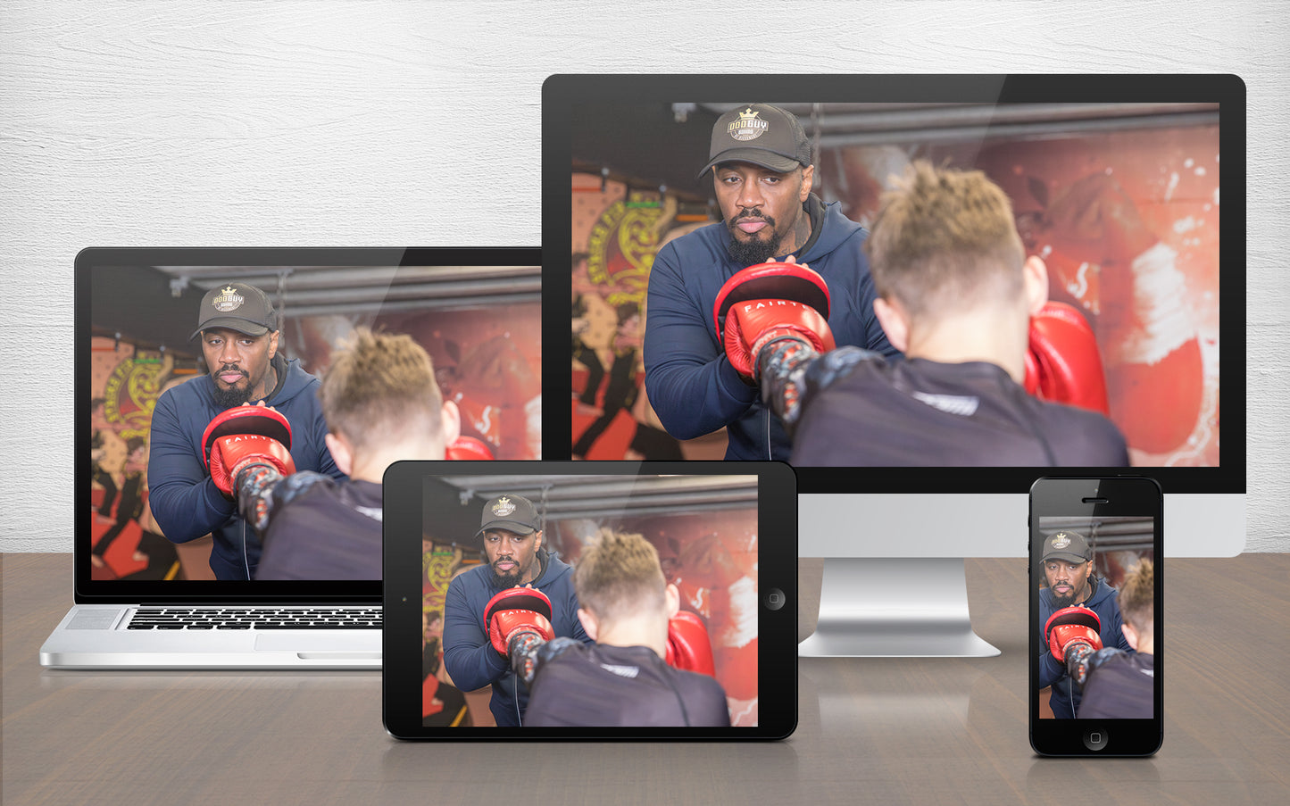 A graphic image of a boxing coach demonstrating pad work