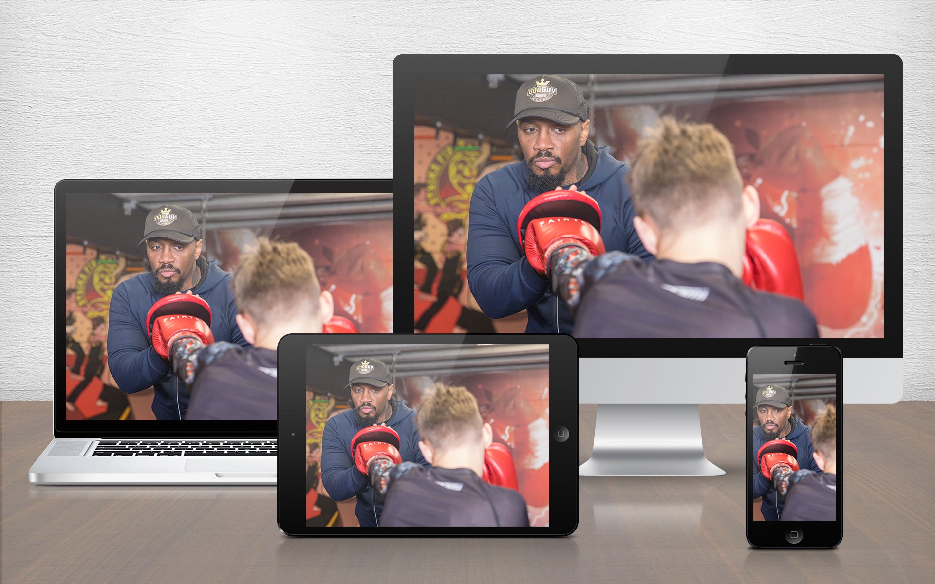 A graphic image of a boxing coach demonstrating pad work