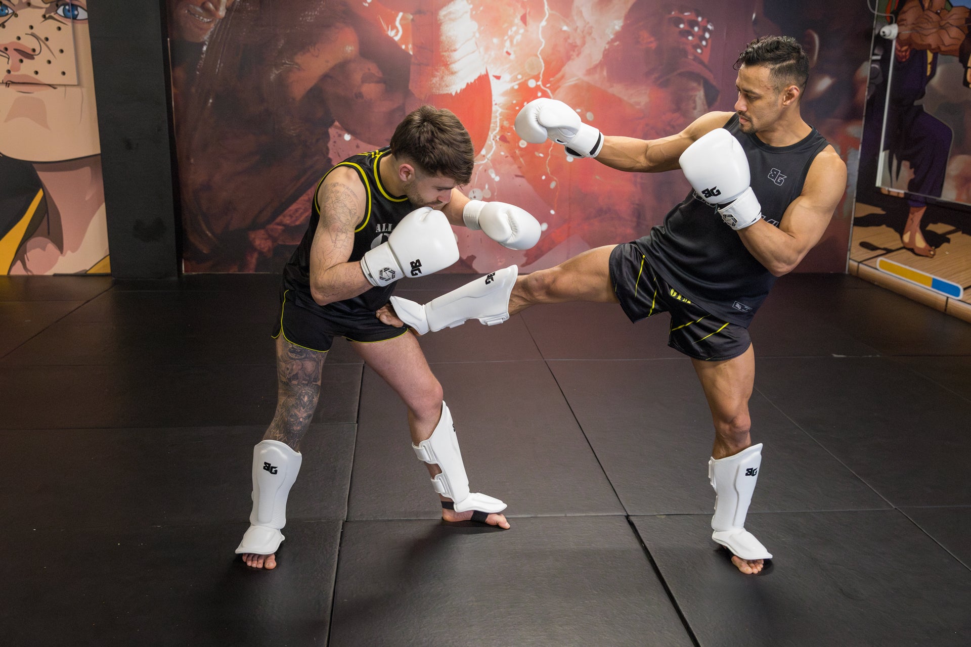 A photo of two fighters demonstrating Muay Thai techniques
