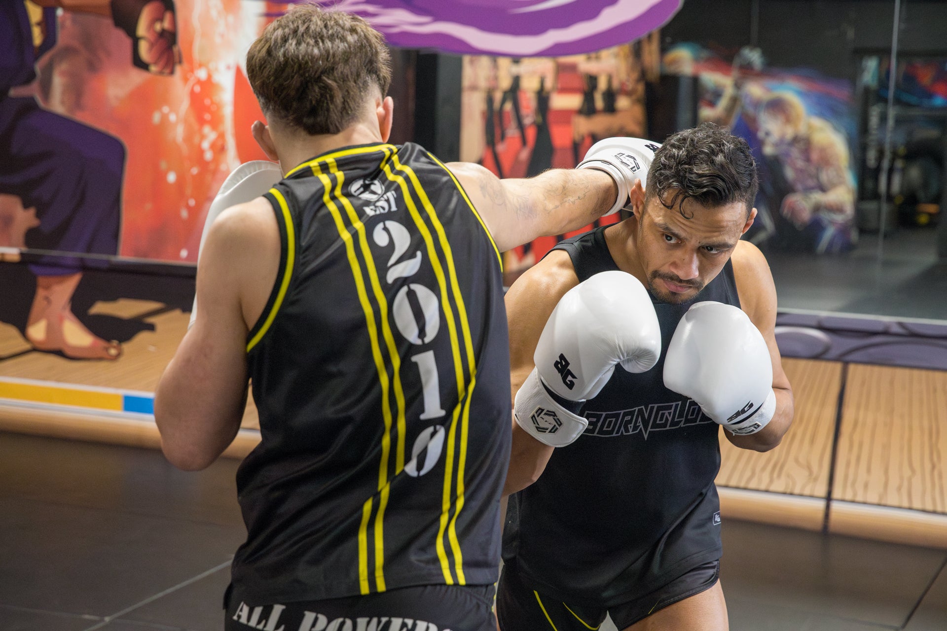 A photo of two fighters demonstrating Muay Thai techniques