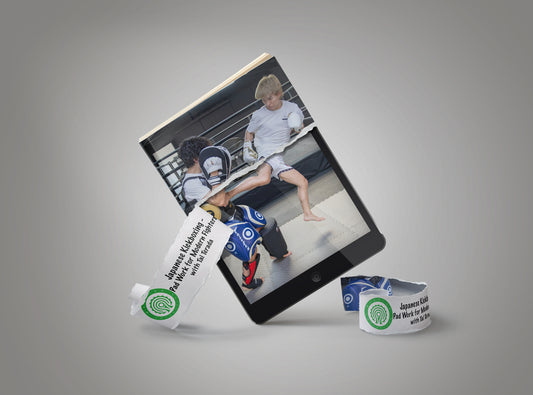 A tablet device displaying a martial arts photo taken in a gym