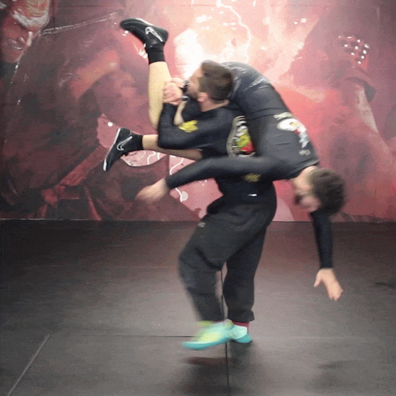 Two athletes grappling together